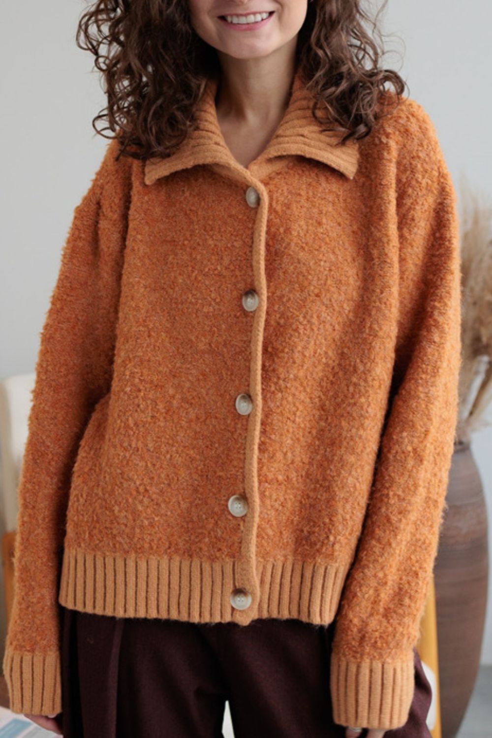 Collared neck button down long sleeve cardigan.
