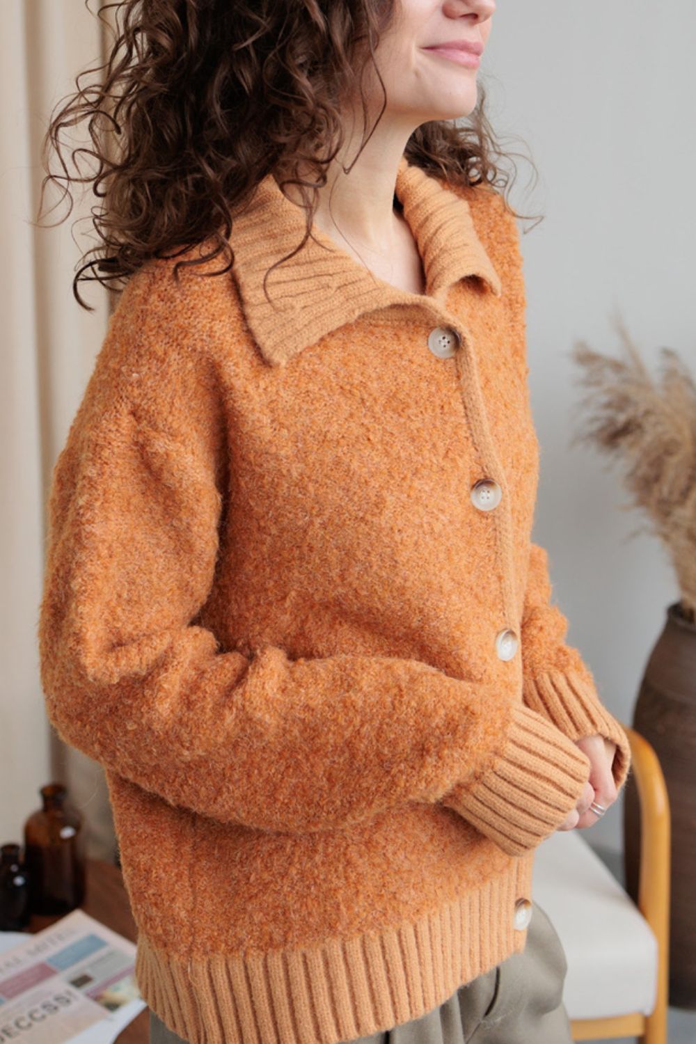 Collared neck button down long sleeve cardigan.