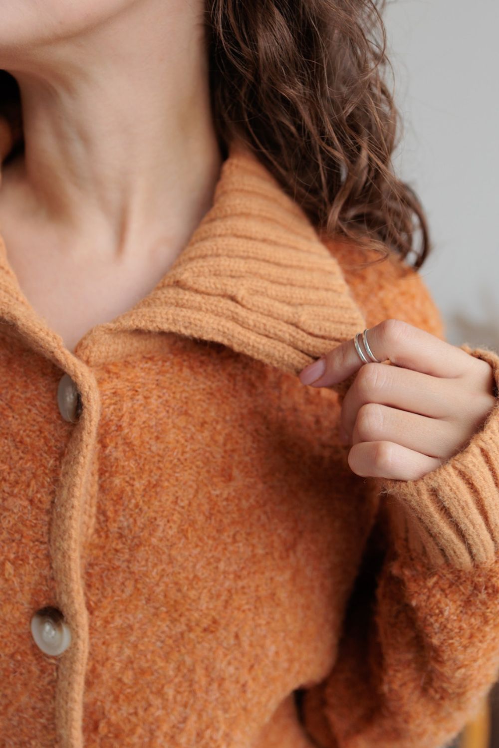 Collared neck button down long sleeve cardigan.
