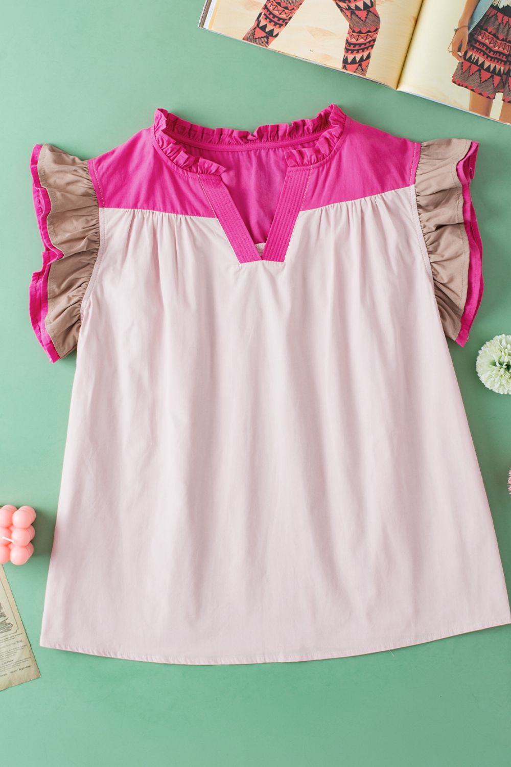 Color block notched ruffled cap sleeve blouse.
