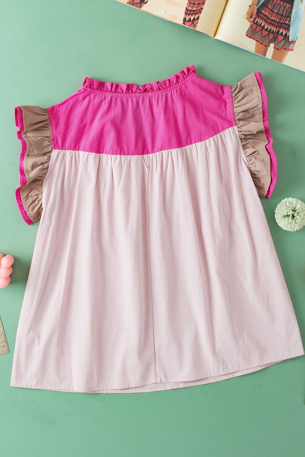 Color block notched ruffled cap sleeve blouse.