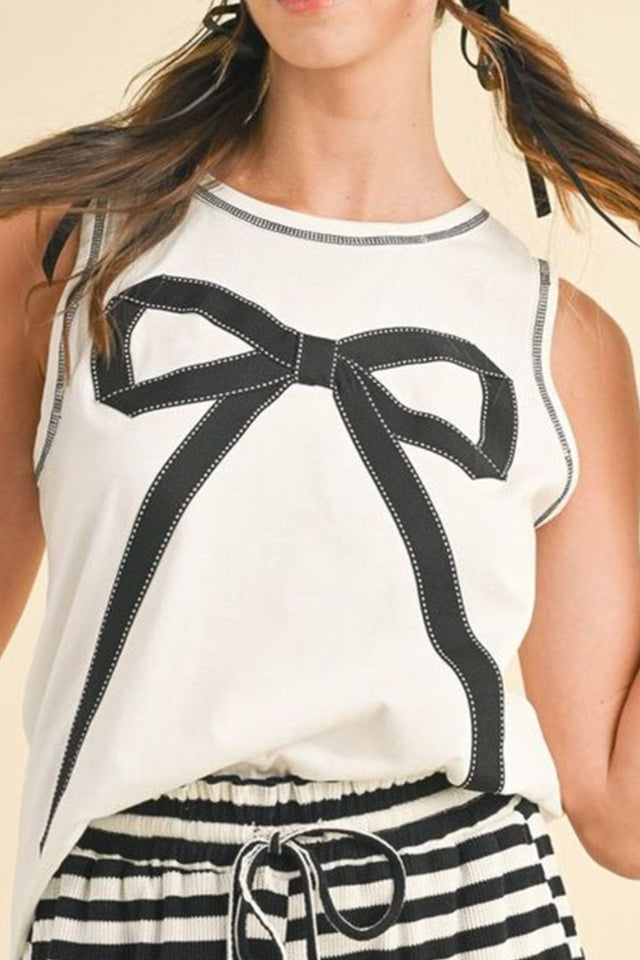Round neck sleeveless top with contrast bow detail.