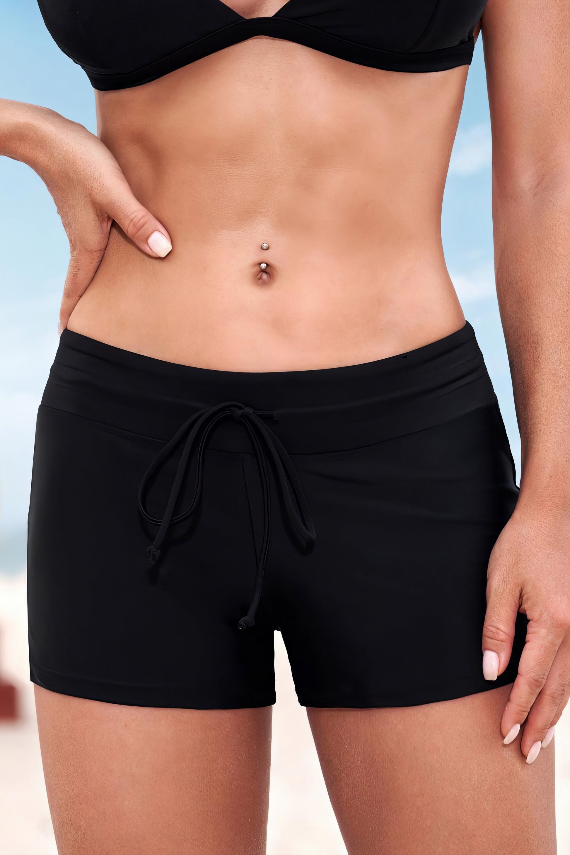 Contrast Drawstring Swim Bottoms in Black. Women's mid-waist swimsuit with moderate stretch. Perfect for swimming!
