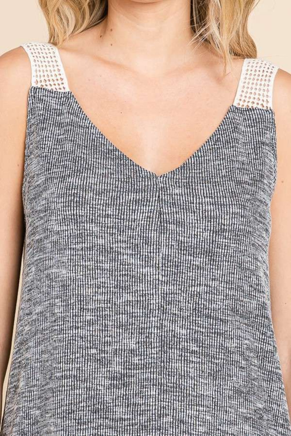 Contrast eyelet strap slit ribbed tank, opaque and moderately stretchy.