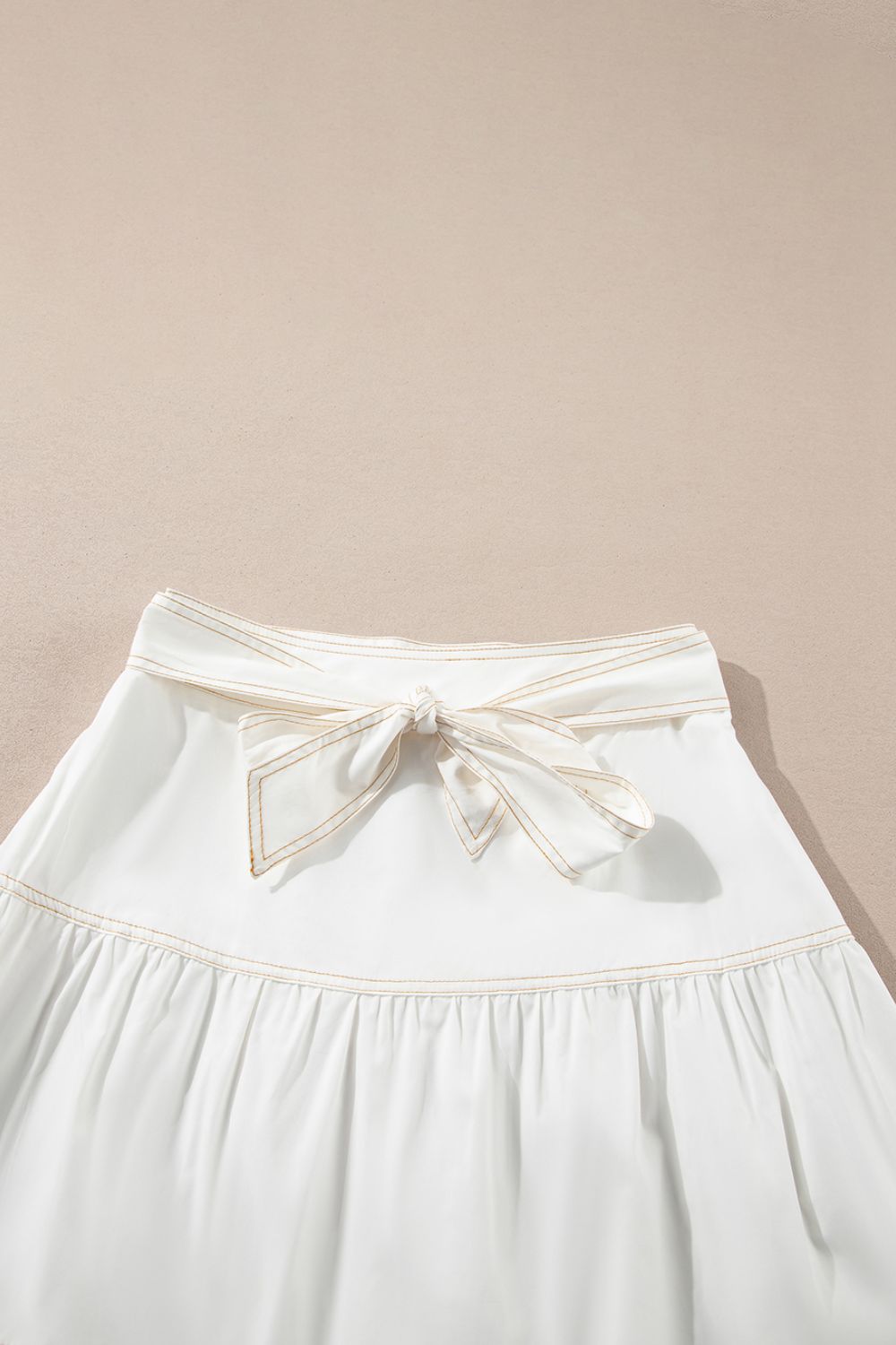 Contrast Stitching Trim Knotted High Waist A-Line Mini Skirt.