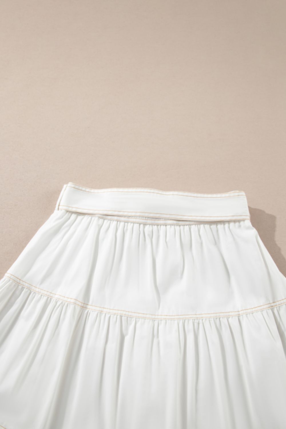 Contrast Stitching Trim Knotted High Waist A-Line Mini Skirt.
