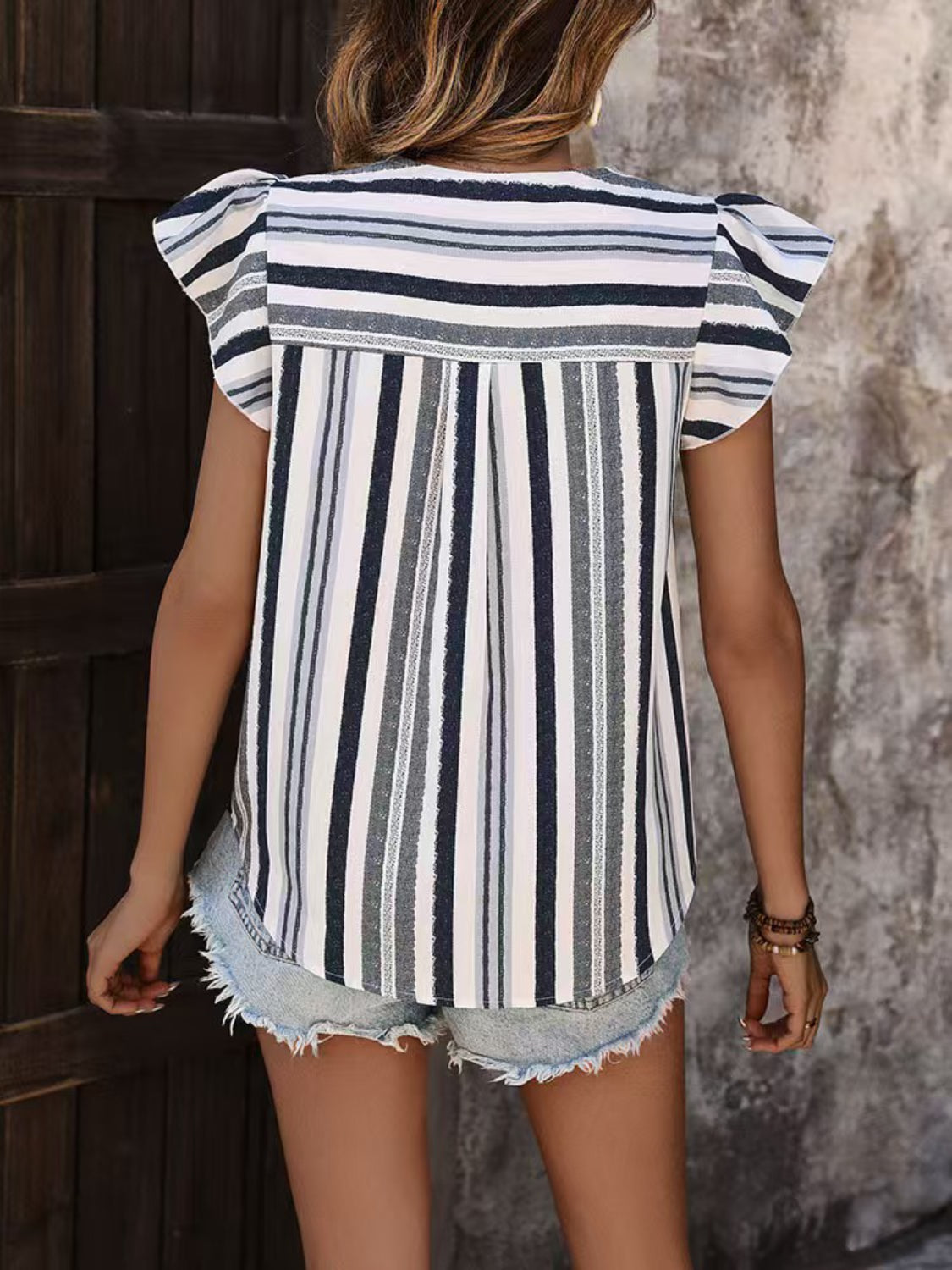 Contrast striped notched ruffled cap sleeve blouse.