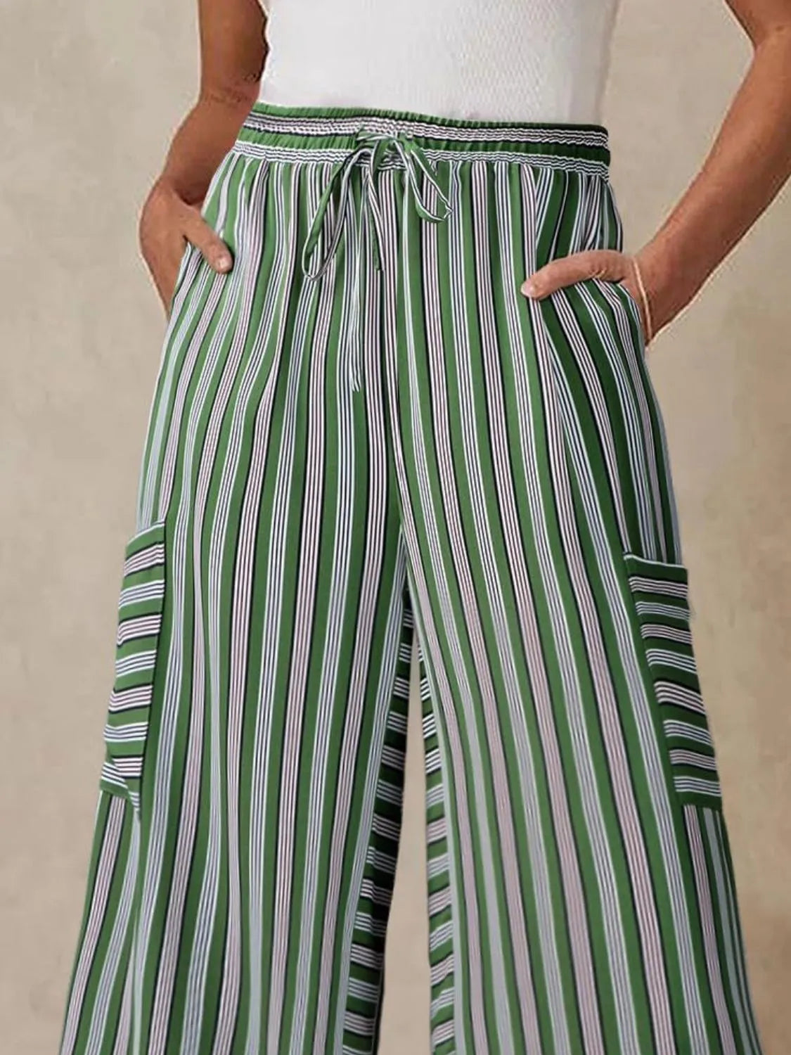 Contrast striped wide leg pants with pockets.