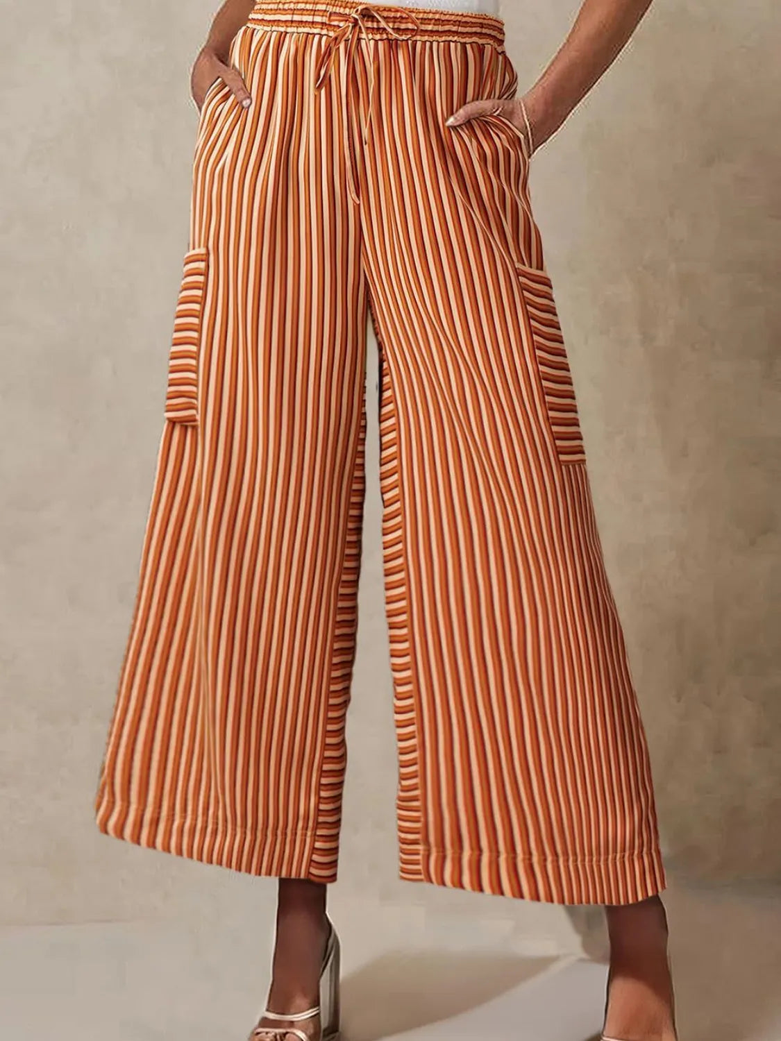 Contrast striped wide leg pants with pockets.