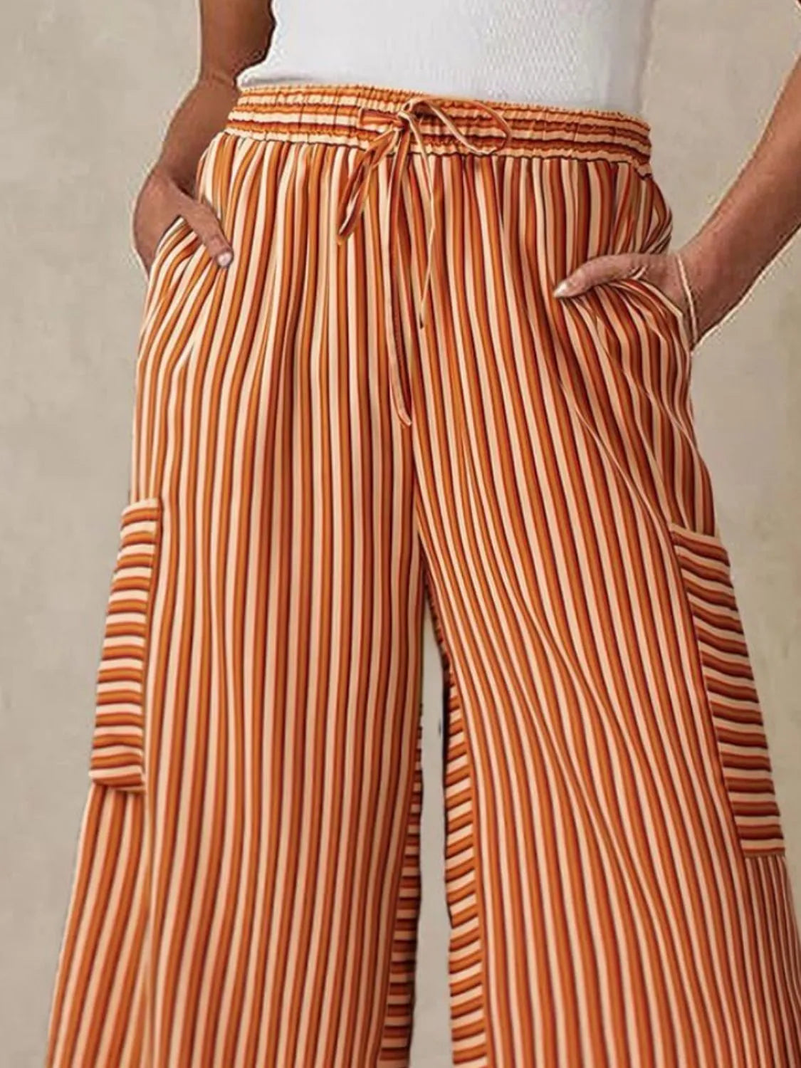 Contrast striped wide leg pants with pockets.