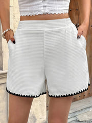 Women's contrast trim shorts with pockets.