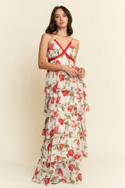 Woman wearing a floral dress with a plain background