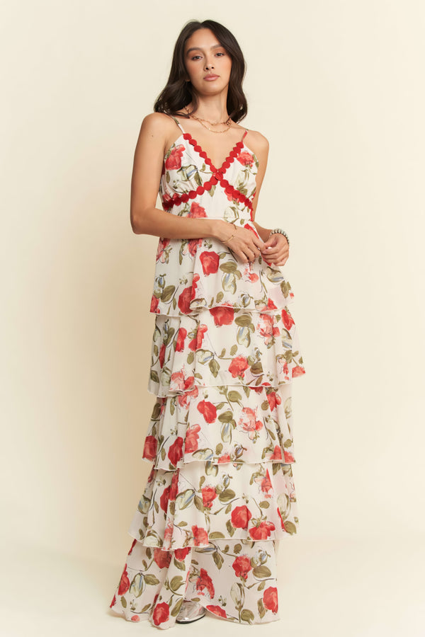 Woman wearing a floral dress with a plain background