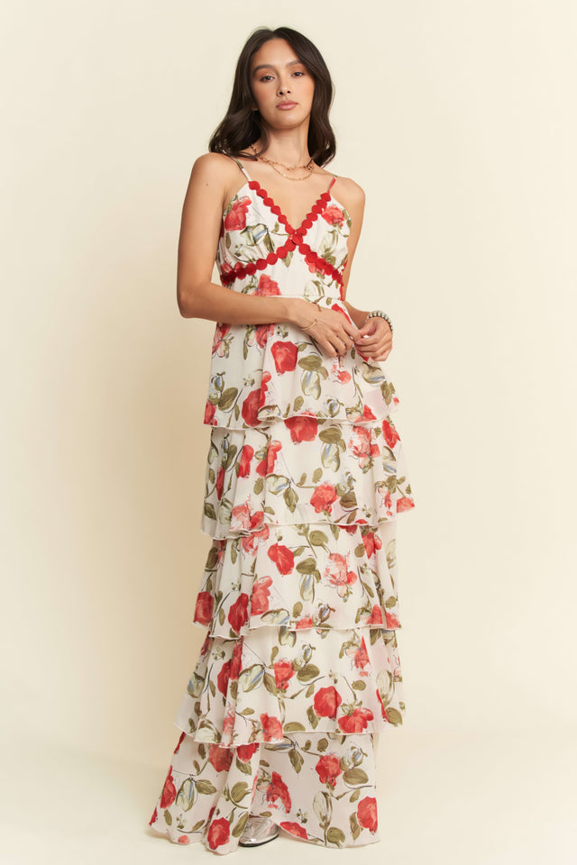 Woman wearing a floral dress with a plain background