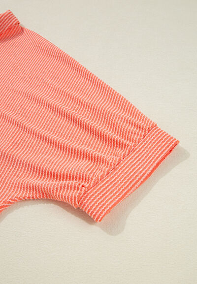 Corded half sleeve button-up high-low shirt.