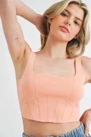 Corset design detail crop knit top with ribbed texture, moderately stretchy.