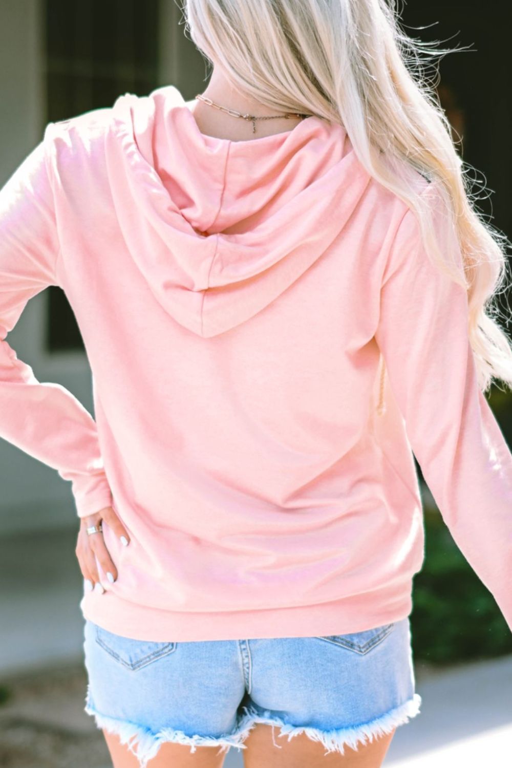 Cow print half zip drawstring hoodie with pockets.
