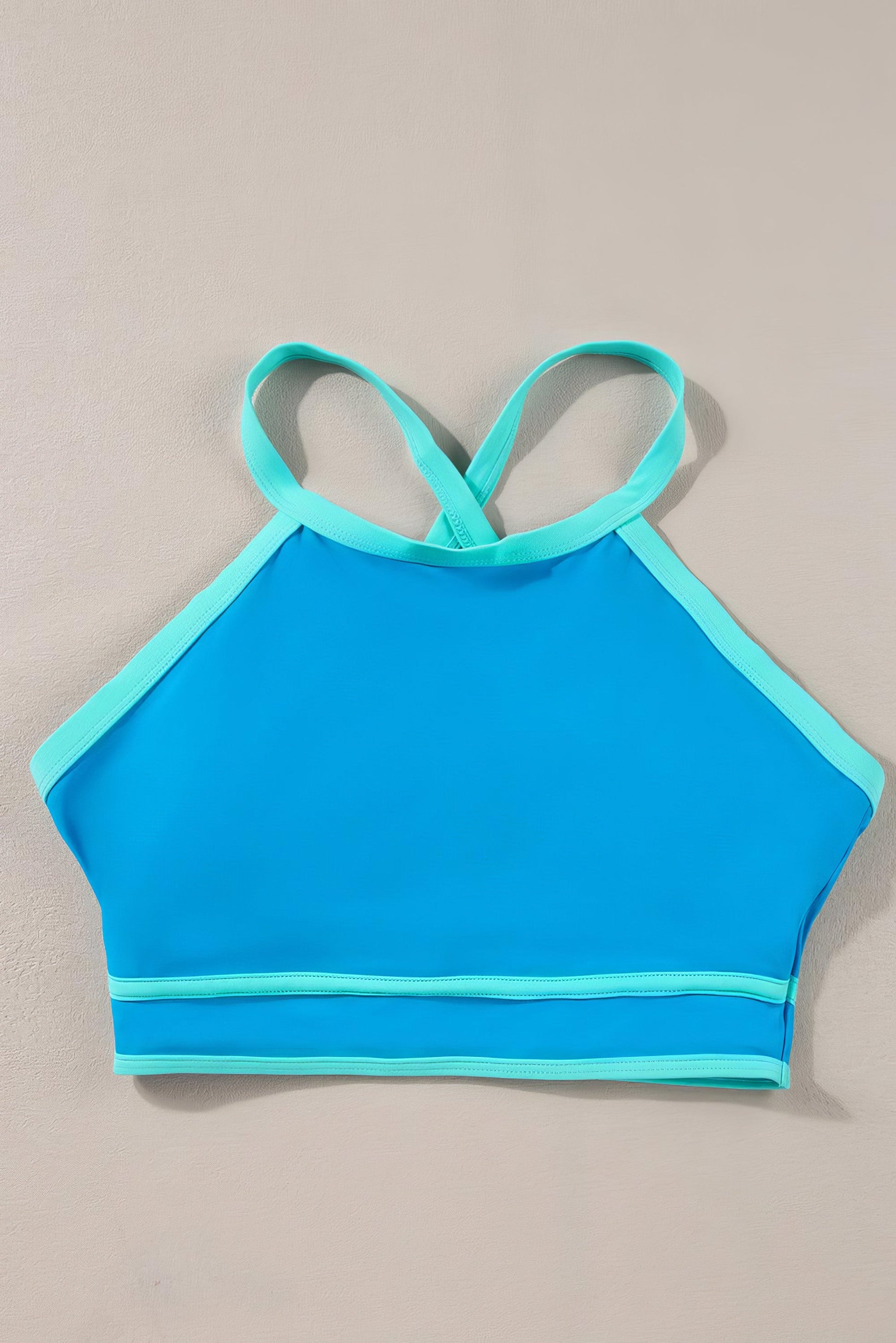 Crisscross round neck two-piece swim set with removable padding.