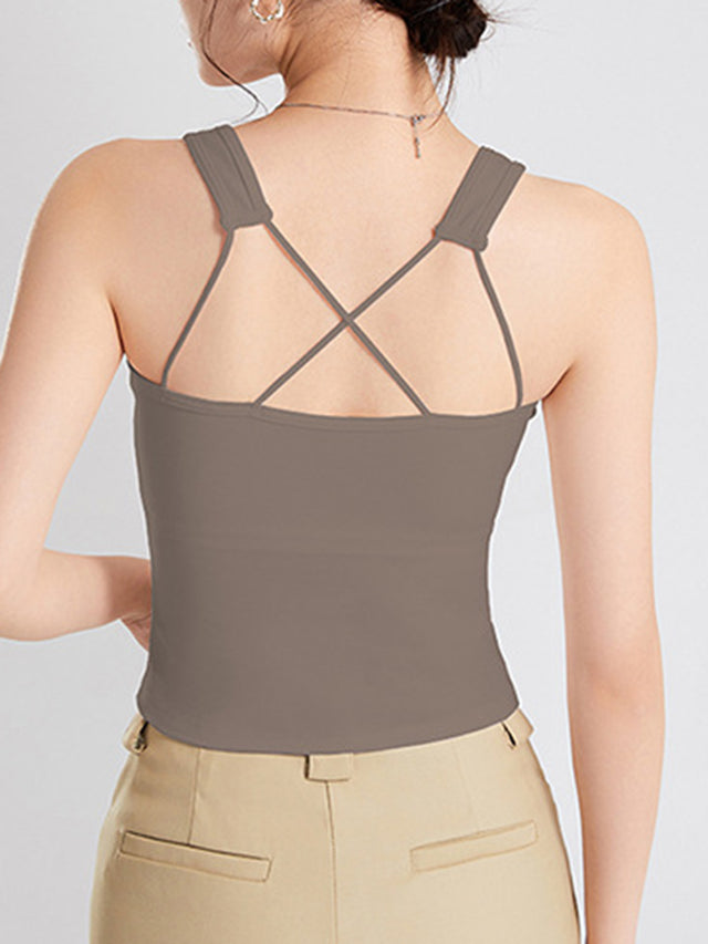 Crisscross scoop neck wide strap cropped tank top with chest pads.