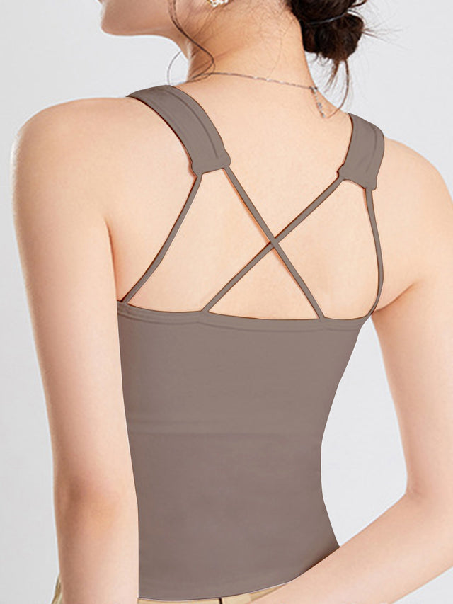 Crisscross scoop neck wide strap cropped tank top with chest pads.