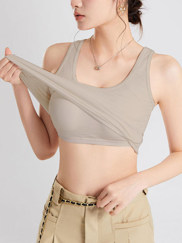 Crisscross scoop neck wide strap cropped tank top with chest pads.