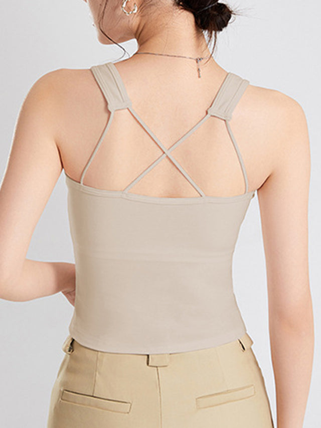Crisscross scoop neck wide strap cropped tank top with chest pads.