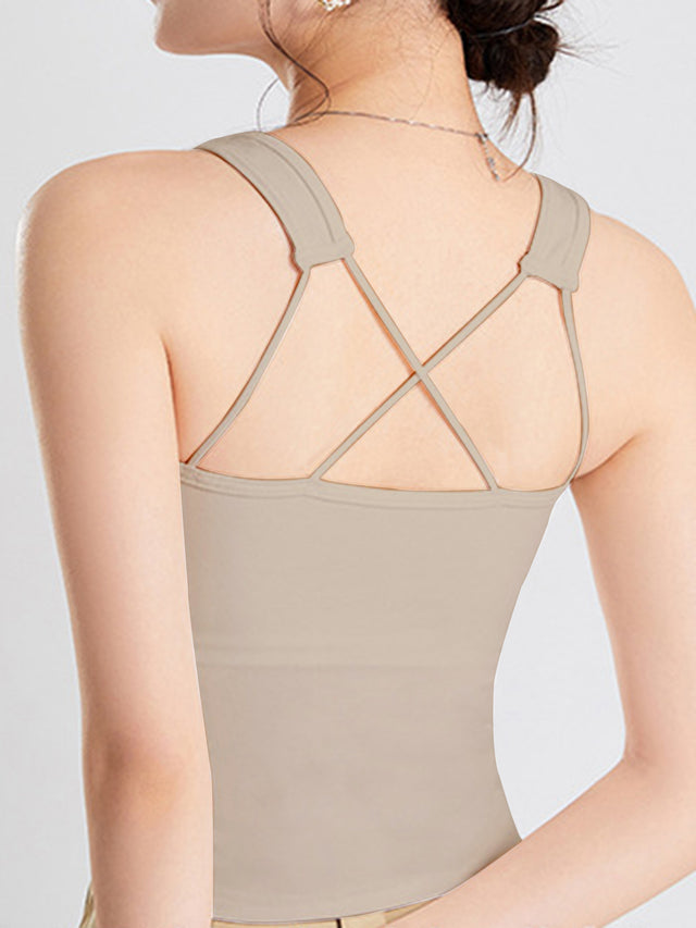 Crisscross scoop neck wide strap cropped tank top with chest pads.