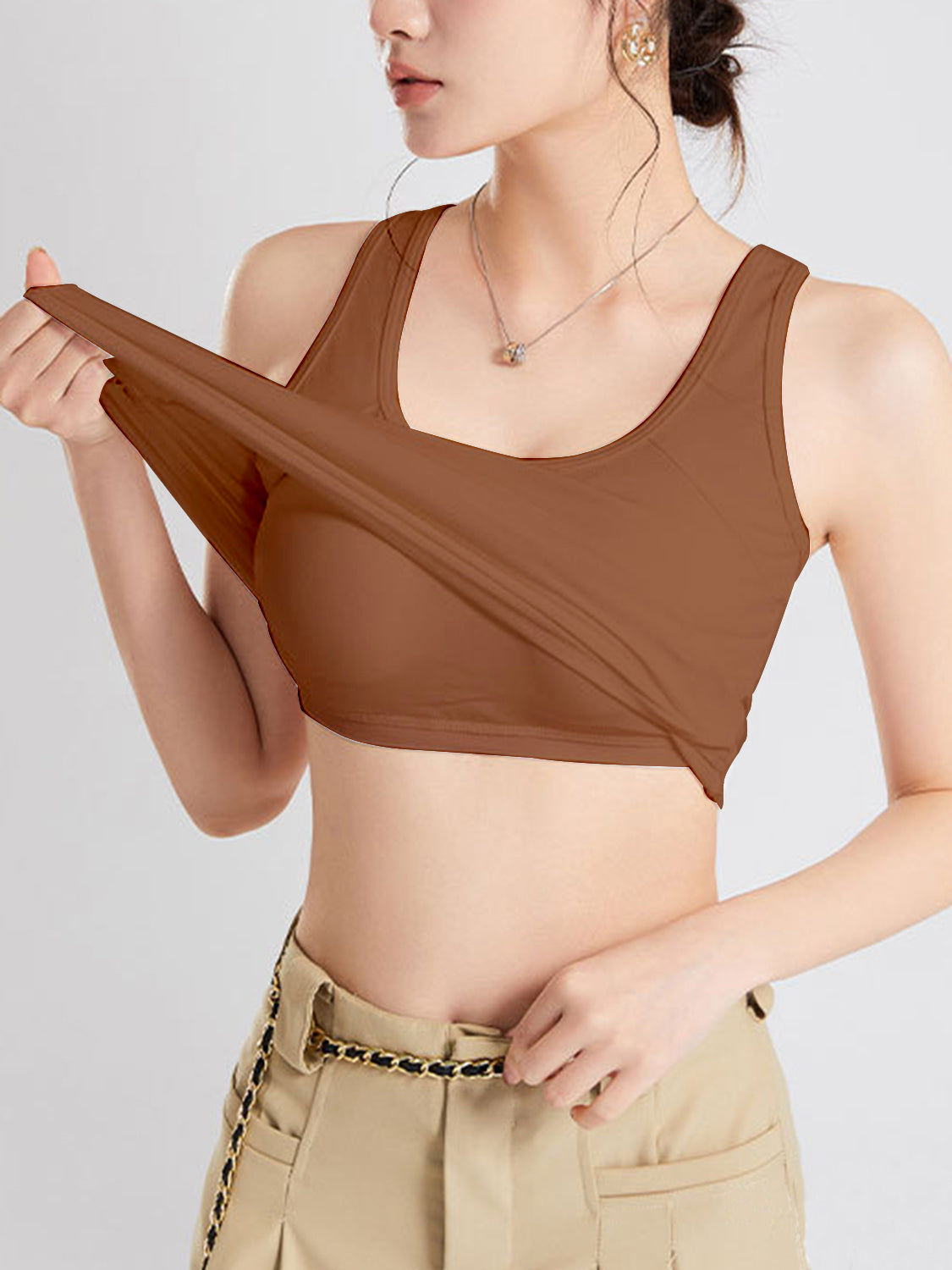 Crisscross scoop neck wide strap cropped tank top with chest pads.