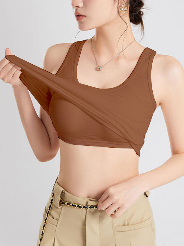 Crisscross scoop neck wide strap cropped tank top with chest pads.