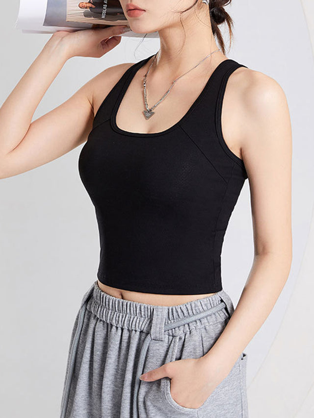 Crisscross scoop neck wide strap cropped tank top with chest pads.