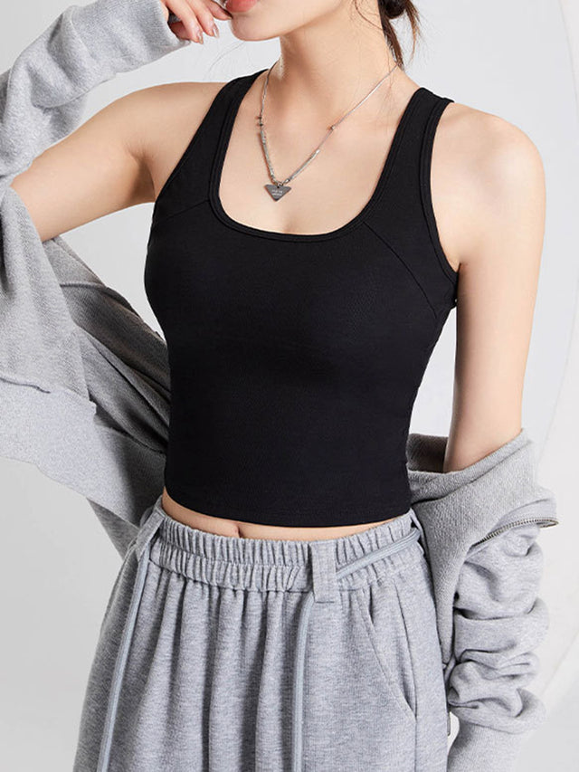 Crisscross scoop neck wide strap cropped tank top with chest pads.