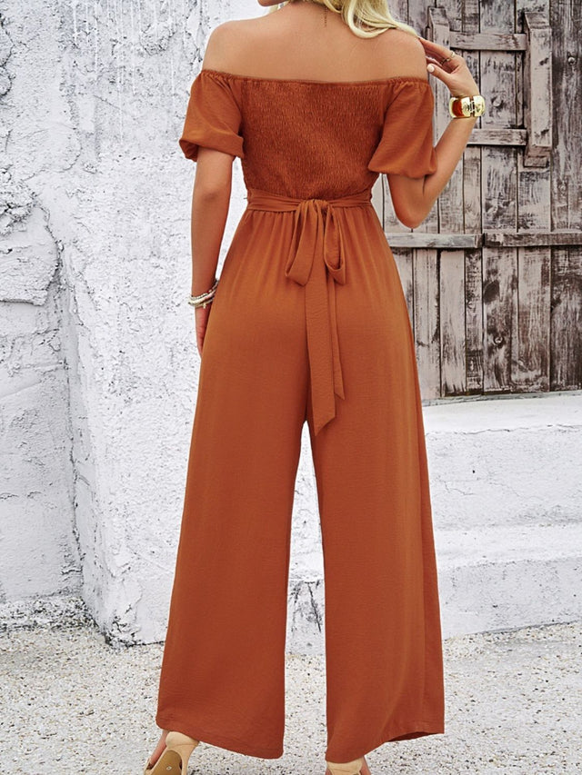 Cutout Off Shoulder Wide Leg Jumpsuit with Tie and Smocked Details.