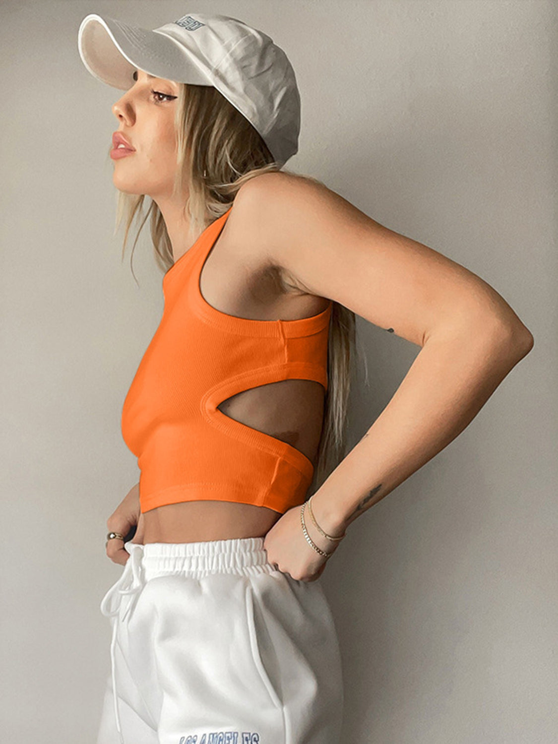 Round neck tank top with cutout details.
