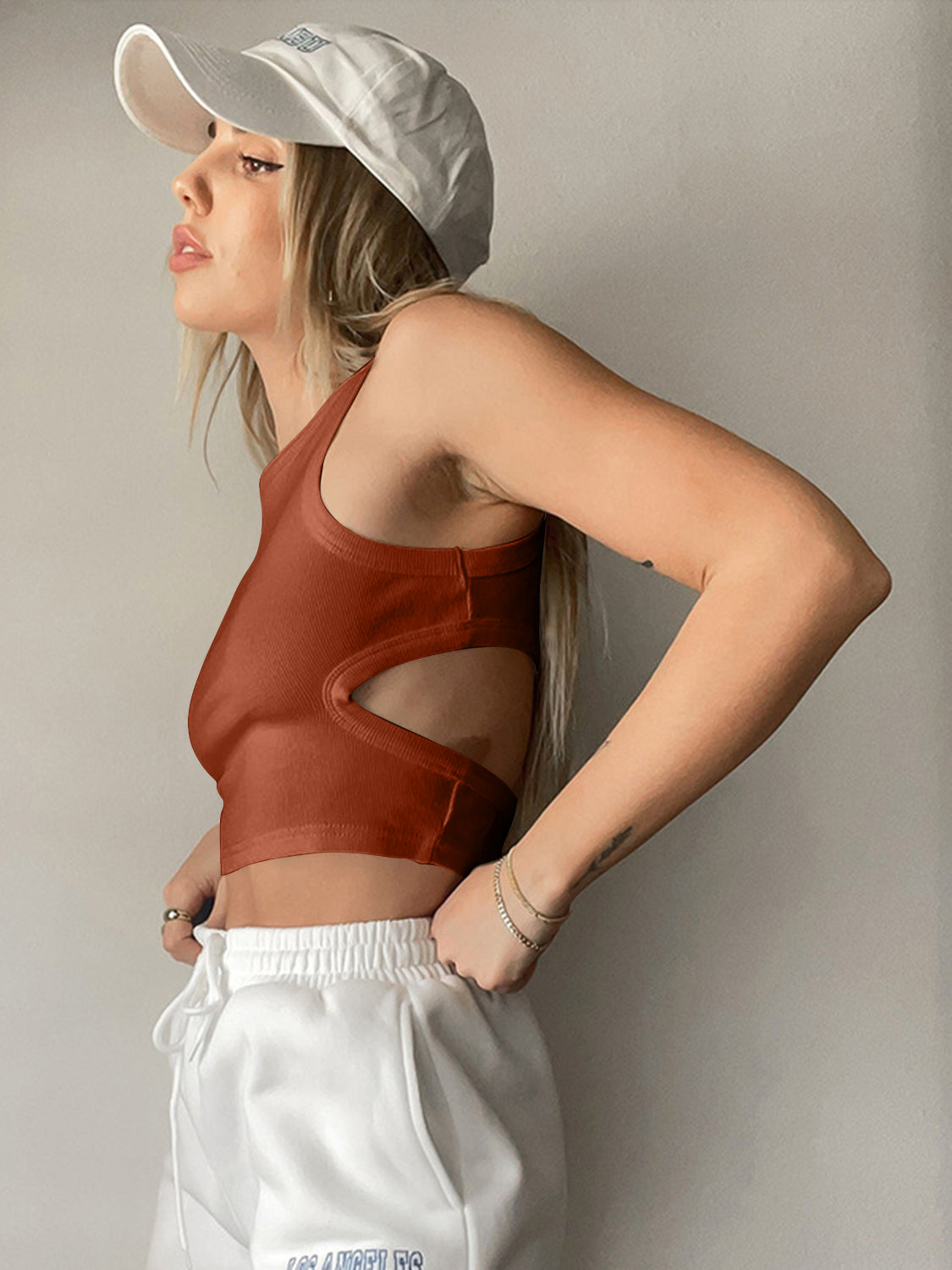 Round neck tank top with cutout details.