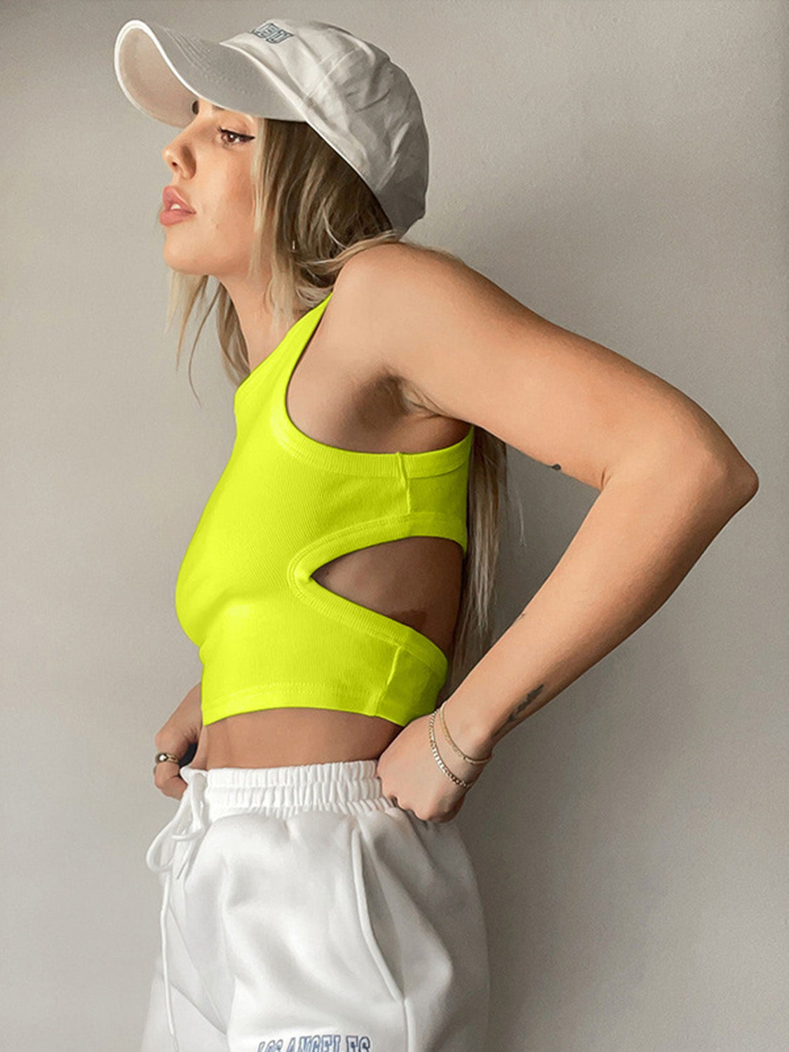 Round neck tank top with cutout details.