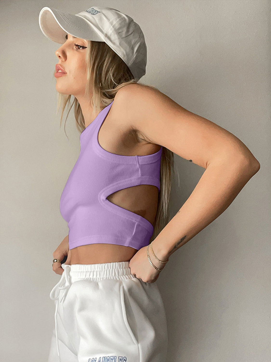 Round neck tank top with cutout details.