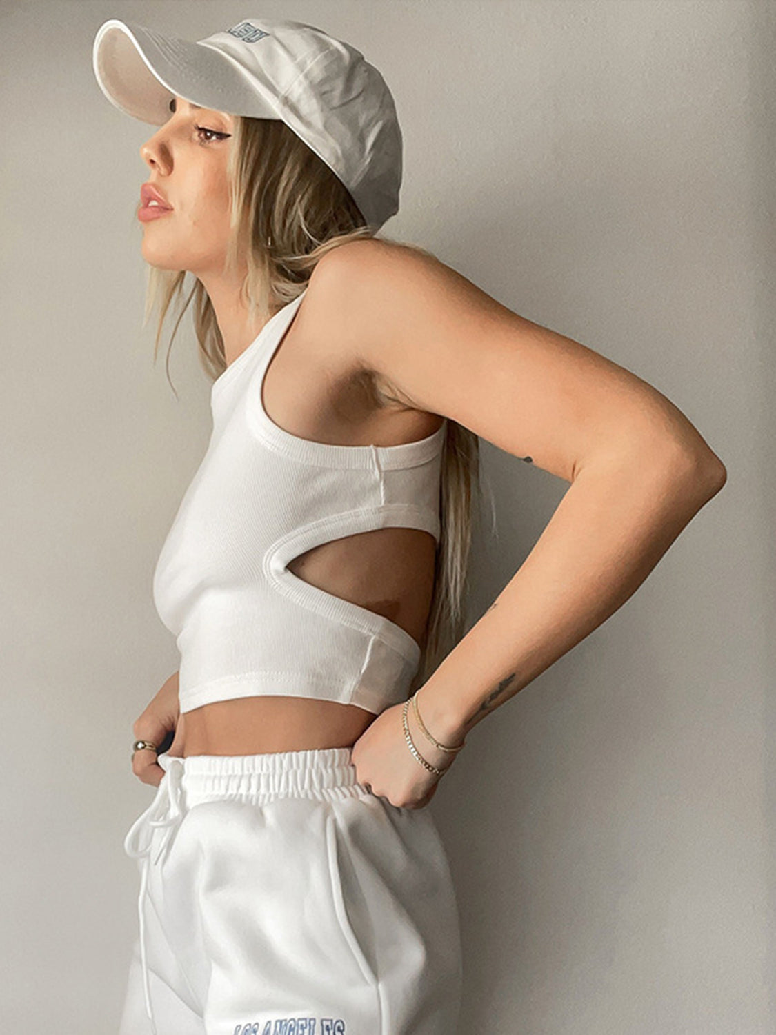 Round neck tank top with cutout details.