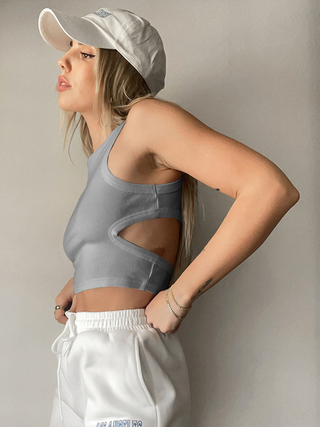 Round neck tank top with cutout details.