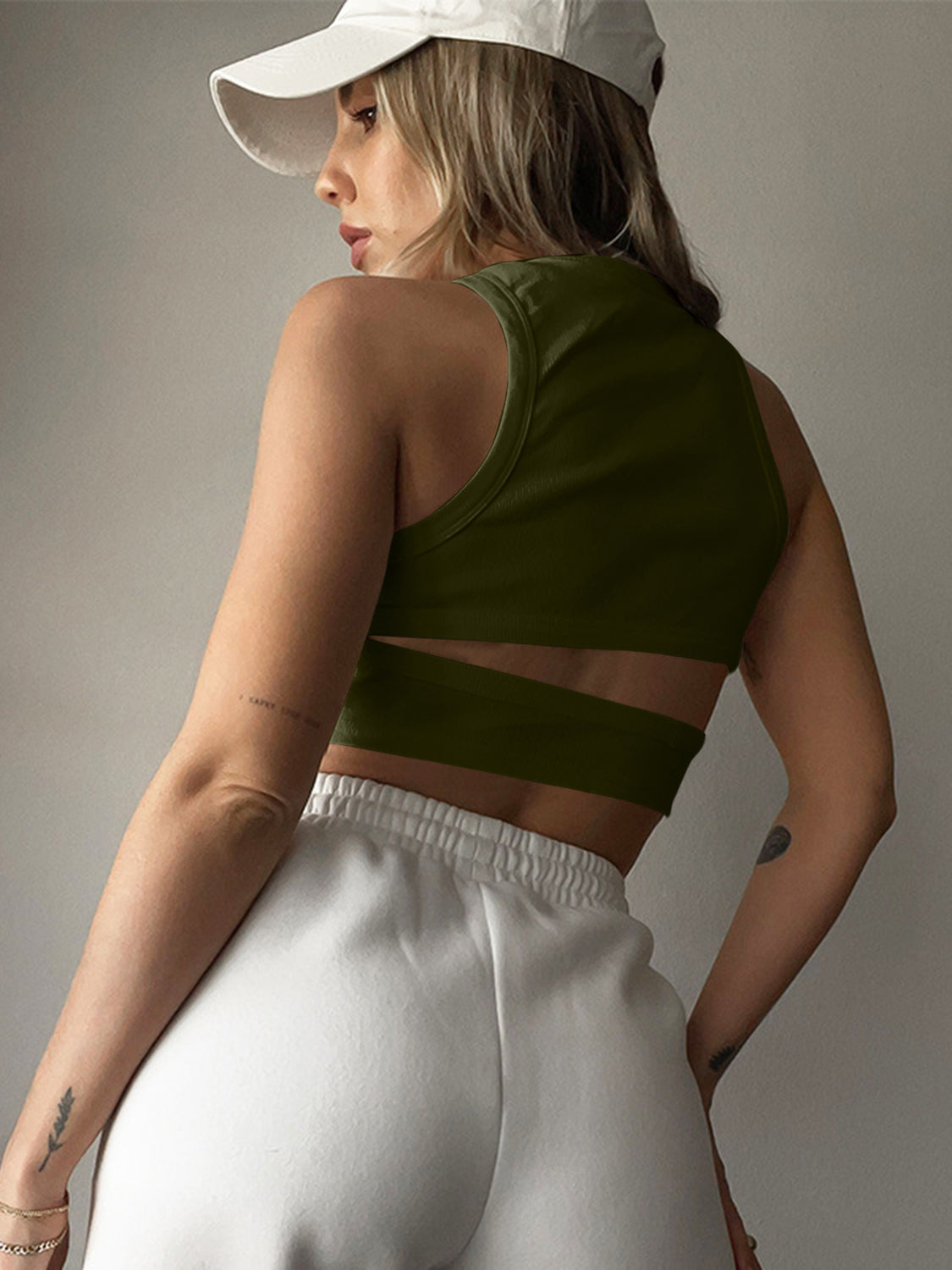 Round neck tank top with cutout details.