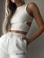 Round neck tank top with cutout details.