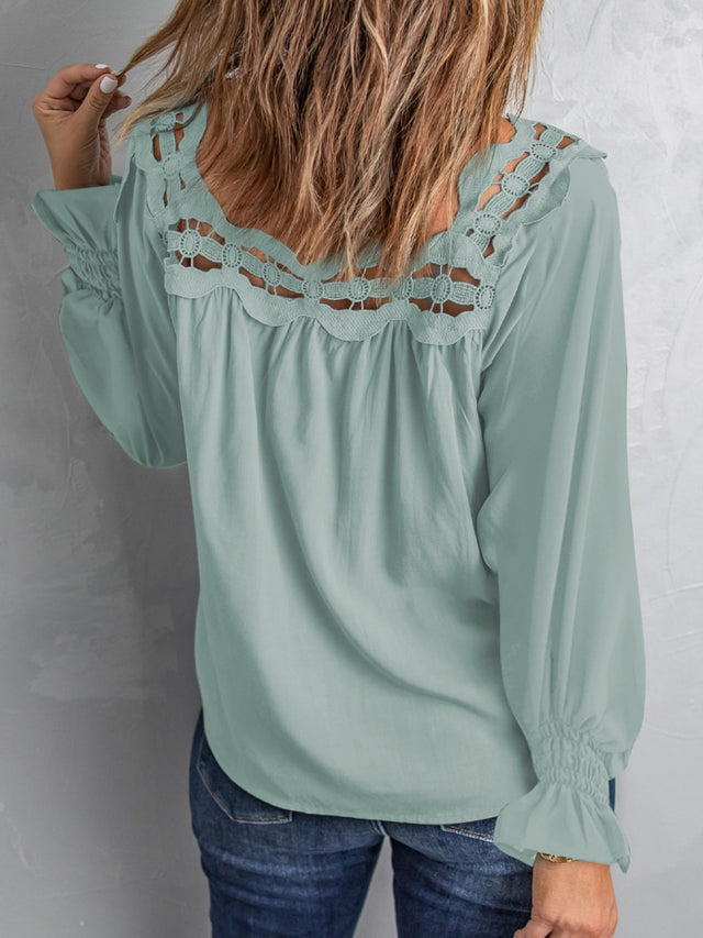 Cutout square neck long sleeve blouse with lace detail.