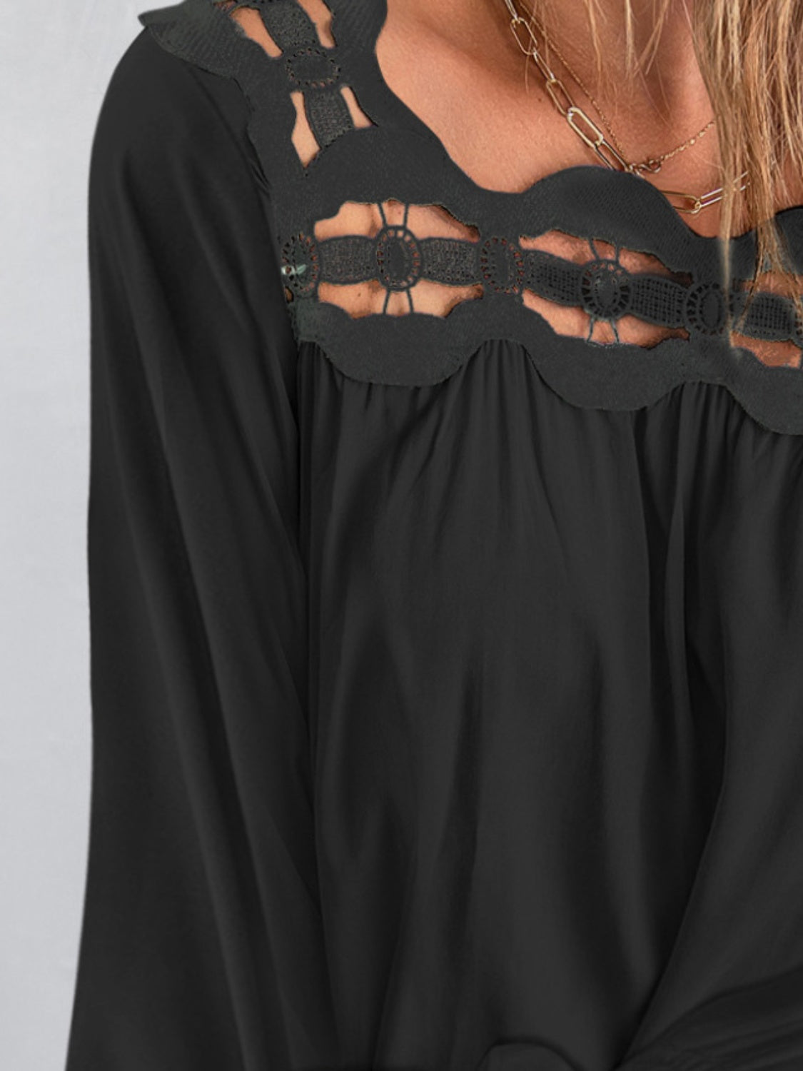 Cutout square neck long sleeve blouse with lace detail.