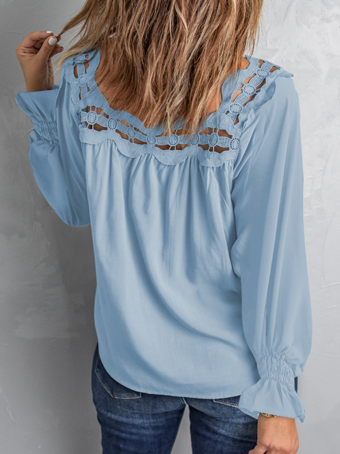 Cutout square neck long sleeve blouse with lace detail.