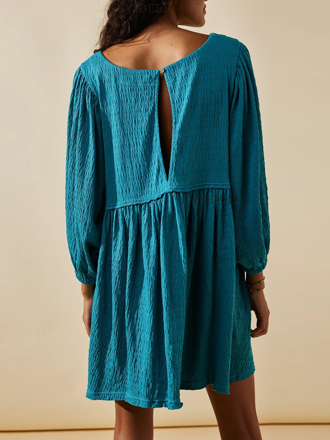 Cutout Textured Long Sleeve Mini Dress.