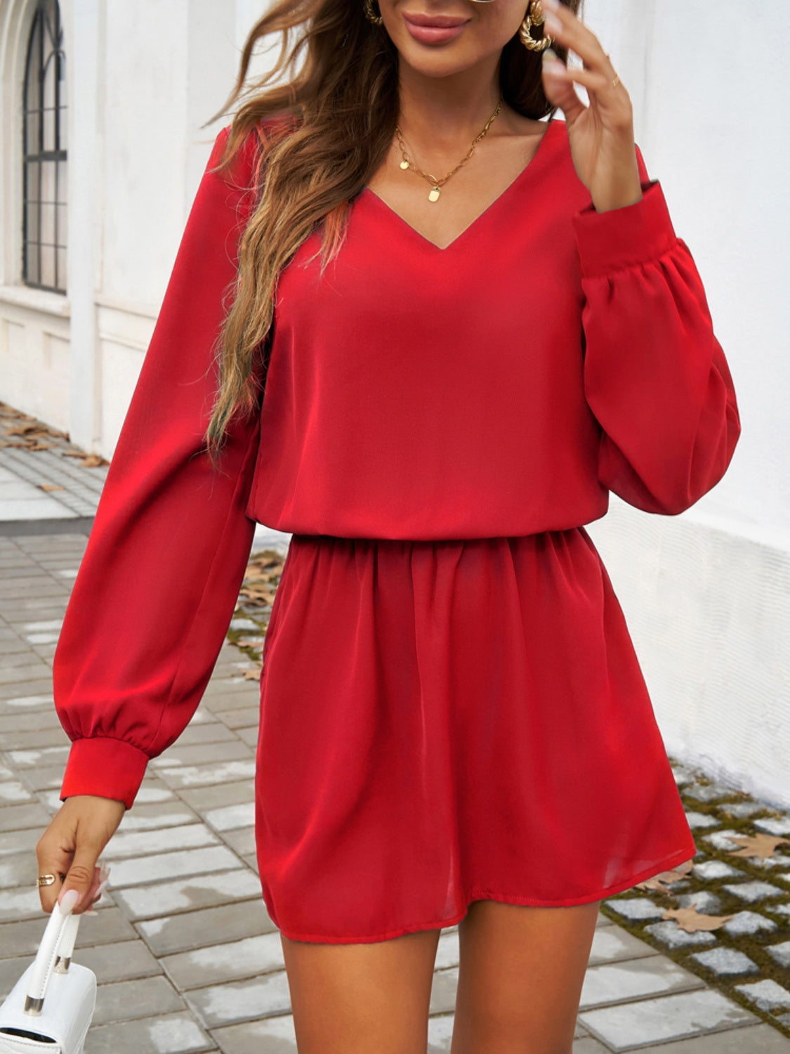 Devine Cutout V-Neck Long Sleeve Mini Dress.