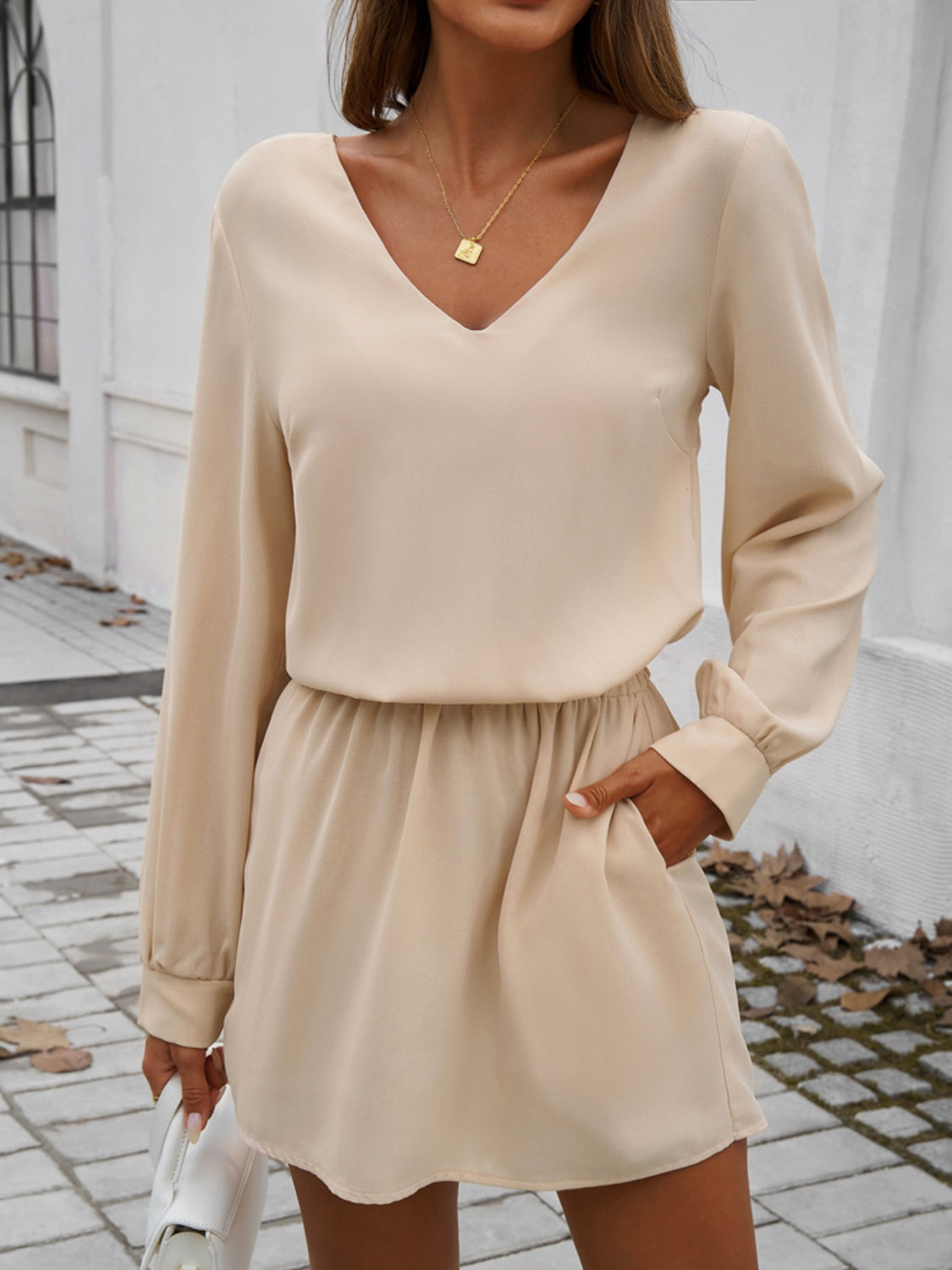 Devine Cutout V-Neck Long Sleeve Mini Dress.
