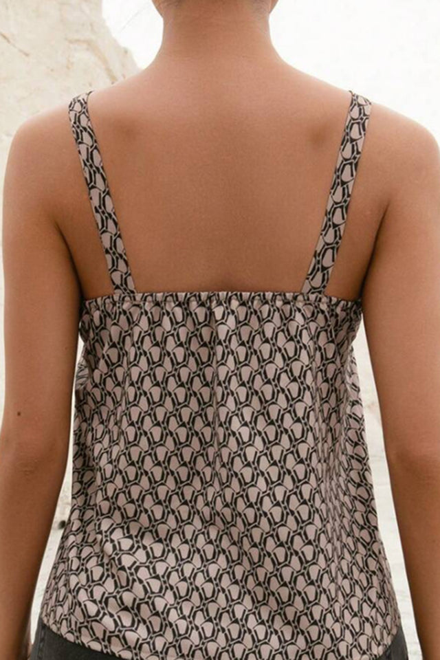 Printed notched tank top with decorative buckle.