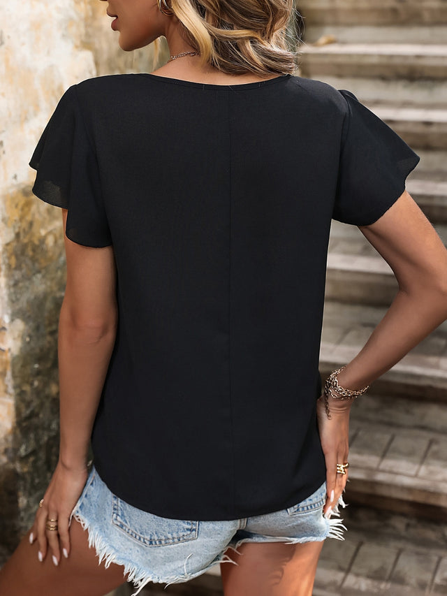 Decorative button round neck short sleeve blouse.