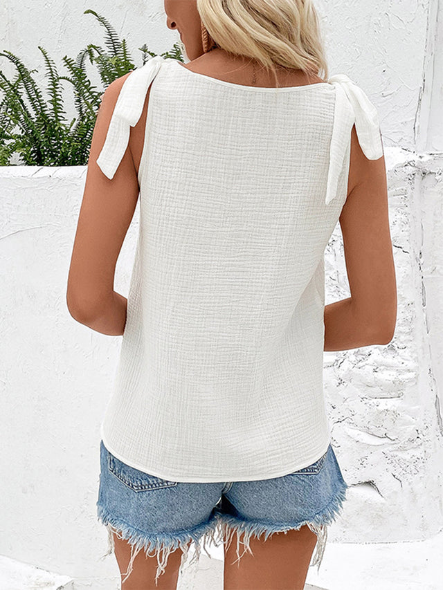 Tied V-neck tank top with decorative buttons.