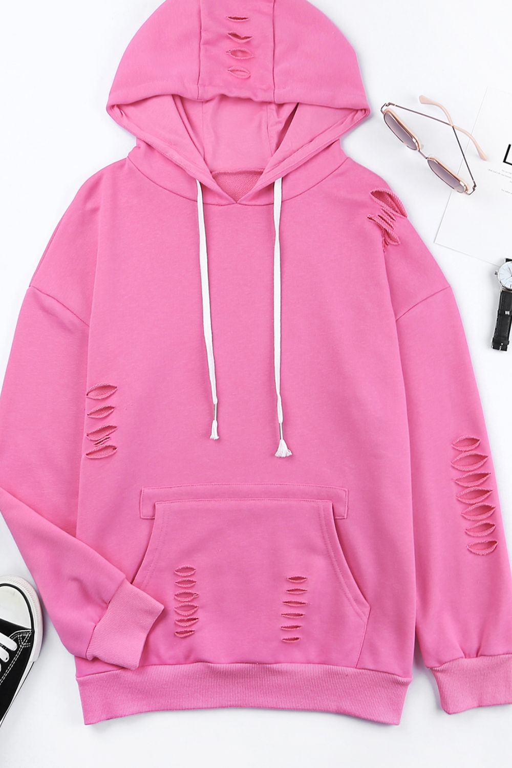 Distressed drawstring long sleeve hoodie with pockets.